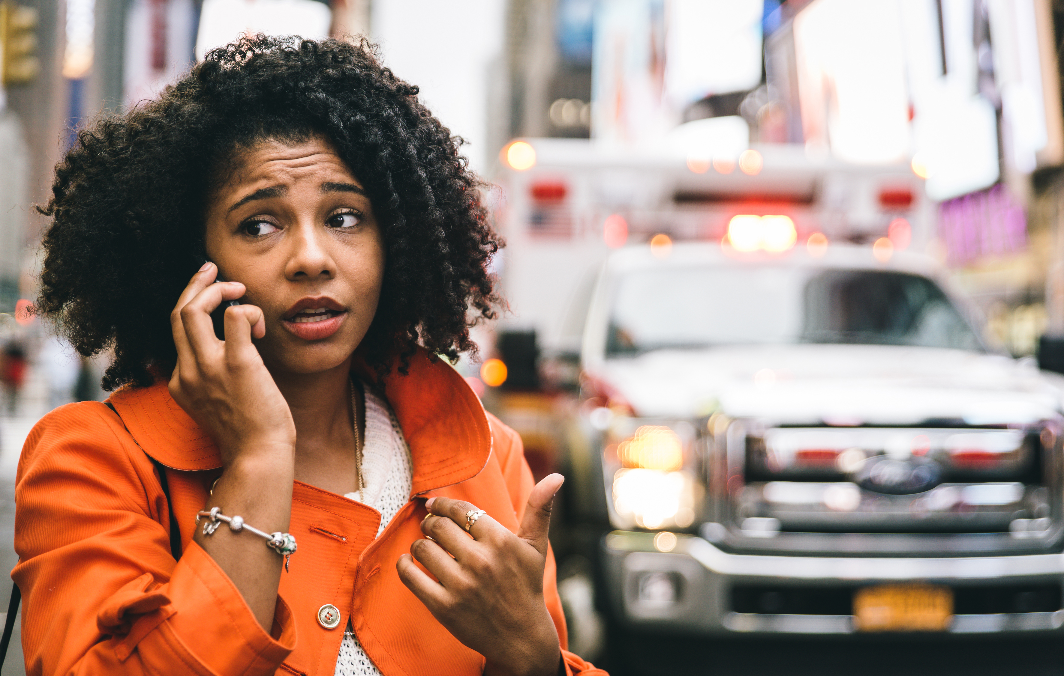 woman-worried-phone-call-car-accident-street