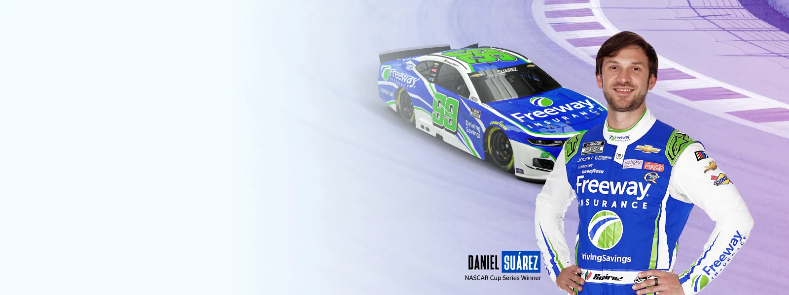 Daniel Suarez de pie frente a su auto de carreras NASCAR #99