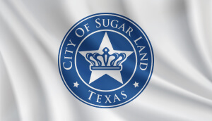 Bandera de Sugar Land, Texas, en movimiento.